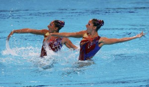 Greece's Evangelia Platanioti and Despoina Solomou perform in the synchronised swimming duet technical routine preliminaries during the World Swimming Championships at the Sant Jordi arena in Barcelona